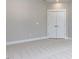 Large bedroom featuring carpet floors and a double door closet with ample storage space at 6059 Scalybark Road, Durham, NC 27712