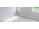 Bright bedroom with neutral carpeting and natural light streaming through two windows at 6059 Scalybark Road, Durham, NC 27712