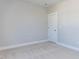 Bright bedroom with neutral walls and carpet at 6059 Scalybark Road, Durham, NC 27712