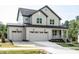 Charming two-story home with a three car garage, covered porch, and lovely landscaping at 6059 Scalybark Road, Durham, NC 27712