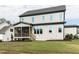 Charming two-story home with a screened porch, a well-manicured lawn, and ample natural light at 6059 Scalybark Road, Durham, NC 27712