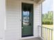 Beautiful green front door with glass panels for natural light at 6059 Scalybark Road, Durham, NC 27712
