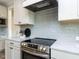 Close-up of a modern kitchen with sleek countertops and stainless steel appliances at 6059 Scalybark Road, Durham, NC 27712