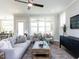 Bright living room with lots of natural light, hardwood floors, and a covered patio at 6059 Scalybark Road, Durham, NC 27712