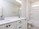 Stylish bathroom with double vanity, white cabinets, and shower at 6060 Scalybark Rd, Durham, NC 27712