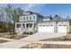 Beautiful two-story home with a covered front porch and an attached garage at 6060 Scalybark Rd, Durham, NC 27712