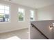 Bright upstairs hallway with natural light, leading to additional rooms in the home at 6060 Scalybark Rd, Durham, NC 27712