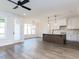 Open-concept kitchen with a center island, modern appliances, and ample counter space at 6060 Scalybark Rd, Durham, NC 27712
