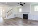 Cozy living room with a fireplace, built-in cabinets, and beautiful hardwood floors at 6060 Scalybark Rd, Durham, NC 27712