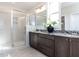 Elegant bathroom with double vanity, large shower, and granite countertop at 6063 Scalybark Road, Durham, NC 27712