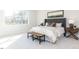 Bright bedroom with large window, plush carpeting, and neutral decor at 6063 Scalybark Road, Durham, NC 27712