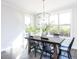 Dining room with farmhouse table and black chairs at 6063 Scalybark Road, Durham, NC 27712
