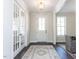Bright entryway with hardwood floors and french doors at 6063 Scalybark Road, Durham, NC 27712