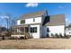 Two-story home with white siding and screened porch at 6063 Scalybark Road, Durham, NC 27712