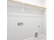 Laundry room with built-in shelving and tile floor at 6063 Scalybark Road, Durham, NC 27712