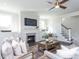 Spacious living room with a fireplace and hardwood floors at 6063 Scalybark Road, Durham, NC 27712