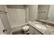 Well-lit bathroom features a shower-tub combo, white toilet, and granite vanity top with modern fixtures at 234 Crystal Springs Way, Benson, NC 27504