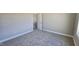 Bedroom with neutral walls and carpet, white baseboard trim, and a view to the outside through the window at 234 Crystal Springs Way, Benson, NC 27504