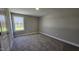 A bedroom with neutral paint and carpet, white trim, and a closet to the left at 234 Crystal Springs Way, Benson, NC 27504