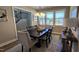 The dining room features ample sunlight from large windows and stylish decor at 234 Crystal Springs Way, Benson, NC 27504