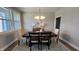 An inviting dining room features a stylish table, chandelier, and windows at 234 Crystal Springs Way, Benson, NC 27504