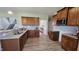 Kitchen with granite countertops, stainless steel appliances, and wood cabinets at 234 Crystal Springs Way, Benson, NC 27504