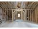 Attic framework with exposed studs and rafters reveals the potential for a customized living space at 30 Imperial Oaks Ct, Youngsville, NC 27596