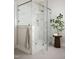 Beautiful bathroom featuring glass shower with elegant marble tile and modern gold hardware at 30 Imperial Oaks Ct, Youngsville, NC 27596
