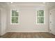 This empty bedroom with bright window light is awaiting personalization at 30 Imperial Oaks Ct, Youngsville, NC 27596