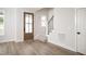 Inviting entryway with a hardwood floor, a wooden front door with a glass panel, and a staircase at 30 Imperial Oaks Ct, Youngsville, NC 27596