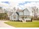 Stunning home with a covered porch and lush green lawn at 30 Imperial Oaks Ct, Youngsville, NC 27596