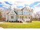 Beautiful two-story home with a covered porch and well-maintained yard at 30 Imperial Oaks Ct, Youngsville, NC 27596
