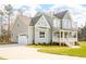 Spacious home with a two-car garage, charming front porch, and well-maintained lawn at 30 Imperial Oaks Ct, Youngsville, NC 27596