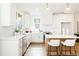 Bright kitchen with white cabinets, stainless steel appliances, and island with seating at 30 Imperial Oaks Ct, Youngsville, NC 27596