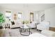 Inviting living room with lots of natural light and neutral furniture at 30 Imperial Oaks Ct, Youngsville, NC 27596