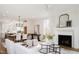 Open-concept living area with fireplace and dining space, perfect for entertaining and everyday living at 30 Imperial Oaks Ct, Youngsville, NC 27596