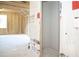 Unfinished room with exposed wooden framework offers potential for customization and expansion in the new home at 30 Imperial Oaks Ct, Youngsville, NC 27596