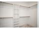 Walk-in closet with built-in shelves and rods, perfect for organization at 30 Imperial Oaks Ct, Youngsville, NC 27596