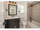 Modern bathroom featuring a tiled shower, black fixtures, and marble vanity top at 122 W Beech Slope Ct, Chapel Hill, NC 27517