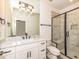 Modern bathroom featuring a marble countertop, a glass shower, and stylish light fixtures at 122 W Beech Slope Ct, Chapel Hill, NC 27517