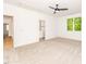 Spacious carpeted bedroom with ceiling fan and natural light, located near attached bath and hallway at 122 W Beech Slope Ct, Chapel Hill, NC 27517