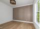 An empty bedroom featuring decorative wall trim, hardwood floors, natural light, and neutral tones at 122 W Beech Slope Ct, Chapel Hill, NC 27517