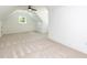 Spacious bonus room featuring neutral carpet and a ceiling fan at 122 W Beech Slope Ct, Chapel Hill, NC 27517