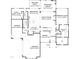 Detailed floor plan showcasing the layout of the first floor, including the living spaces, kitchen, and garage at 122 W Beech Slope Ct, Chapel Hill, NC 27517