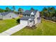 Two-story home with attached garage and landscaped yard at 141 Beacon Hill Rd # 13, Lillington, NC 27546