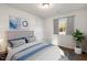 Bedroom with a queen bed and wood floors at 141 Beacon Hill Rd # 13, Lillington, NC 27546