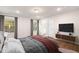 Spacious bedroom with a comfortable bed, large windows, and hardwood floors at 141 Beacon Hill Rd # 13, Lillington, NC 27546