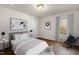 Bedroom with a queen bed and window view at 141 Beacon Hill Rd # 13, Lillington, NC 27546