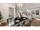 Open concept dining room with kitchen and living room views, stylish table setting and hardwood floors at 141 Beacon Hill Rd # 13, Lillington, NC 27546