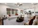 Open living room and kitchen with island, hardwood floors and abundant natural light at 141 Beacon Hill Rd # 13, Lillington, NC 27546